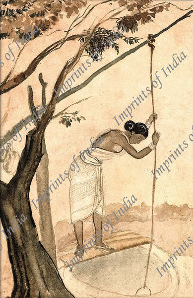 Indian village woman drawing water from the well